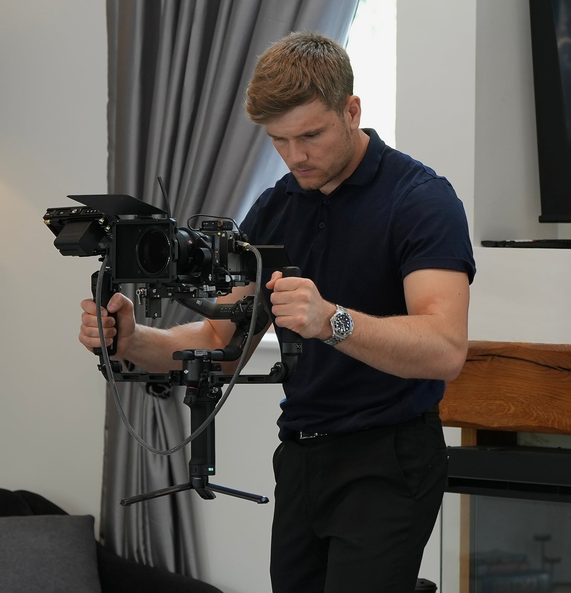 Cameraman filming property video with gimbal in Kent